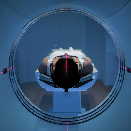 Top-down view of MRI machine in blue lighting