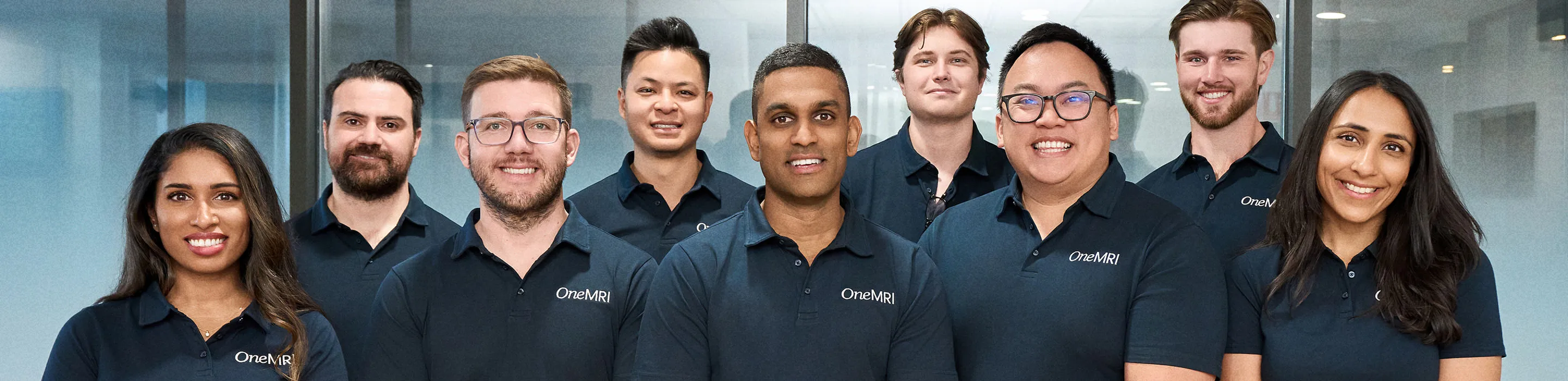 OneMRI medical staff group photo in clinic uniforms