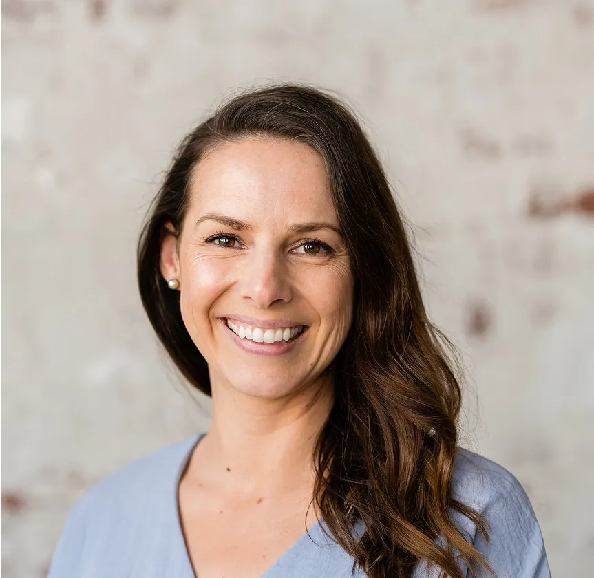 Friendly female medical professional smiling at camera